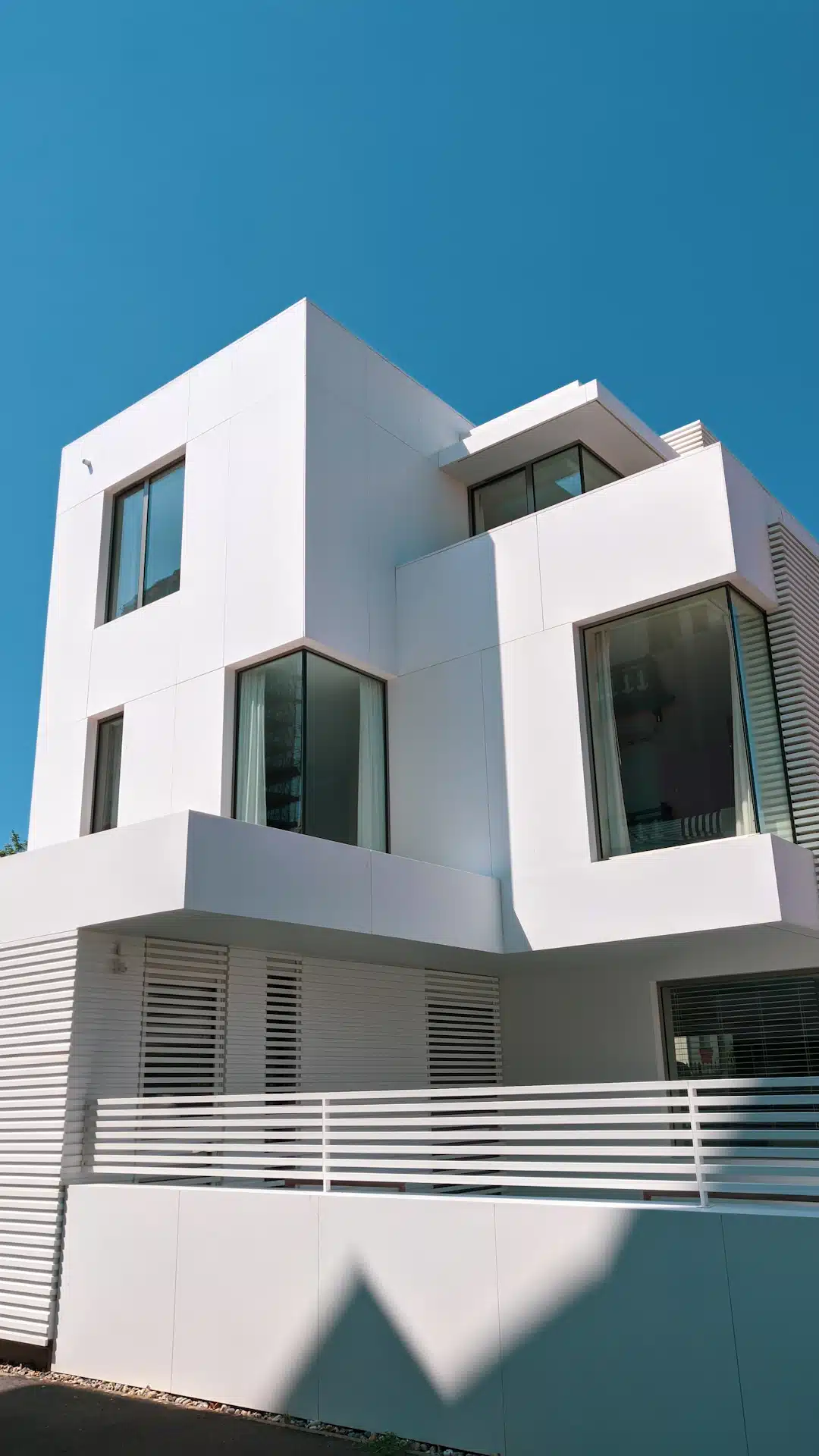 white concrete building under blue sky during daytime